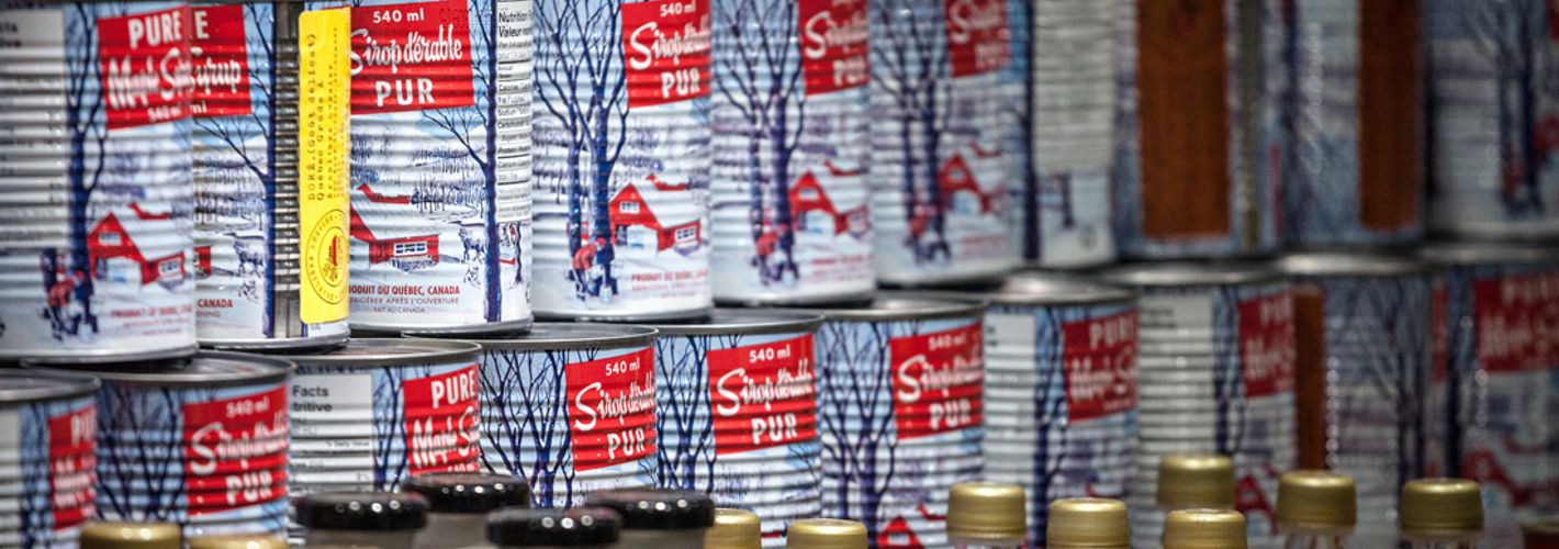 Cans of maple syrup