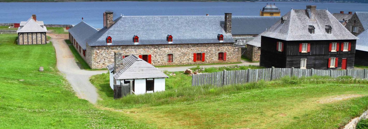 Historic buildings and walls along the water.
