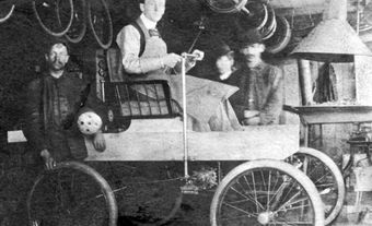 Photographic image of George Foote Foss sitting in the semi-completed Fossmobile