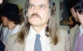 A photograph of Pierre Vallières standing in a crowd during an event.