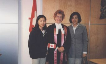 Two Taiwanese Canadian besides a Canadian citizenship judge