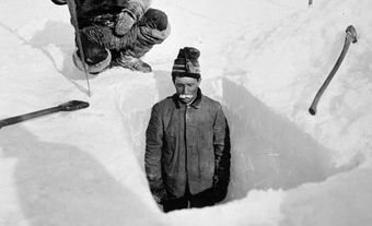 Digging hole to obtain thickness of ice, Fullerton [Harbour], Northwest Territories, Winter 1903–04