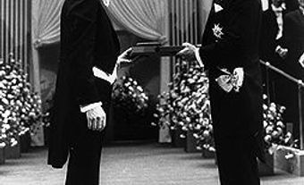 John Polanyi receiving his share of the Nobel Prize in Chemistry from King Carl Gustaf of Sweden, 10 December 1986.