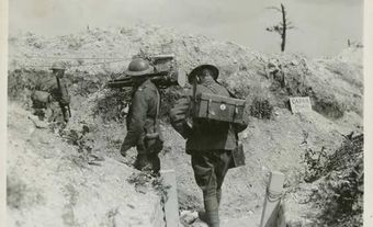 Members of the Canadian War Records Office camera team carrying their equipment.