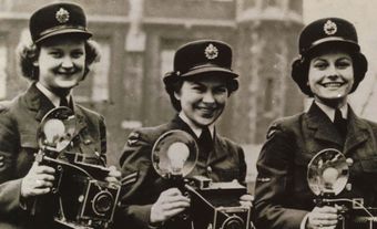 Patricia Collins (née Holden) was one of three press photographers working in the Public Relations Department of Lincoln's Inn Fields, London, England, 1944. 