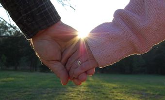 a-married-couple-holding-hands