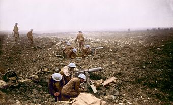 Canadian machine gunners dig themselves in shell holes on Vimy Ridge.