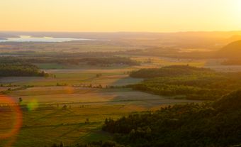 Sunset over agricultural fields.